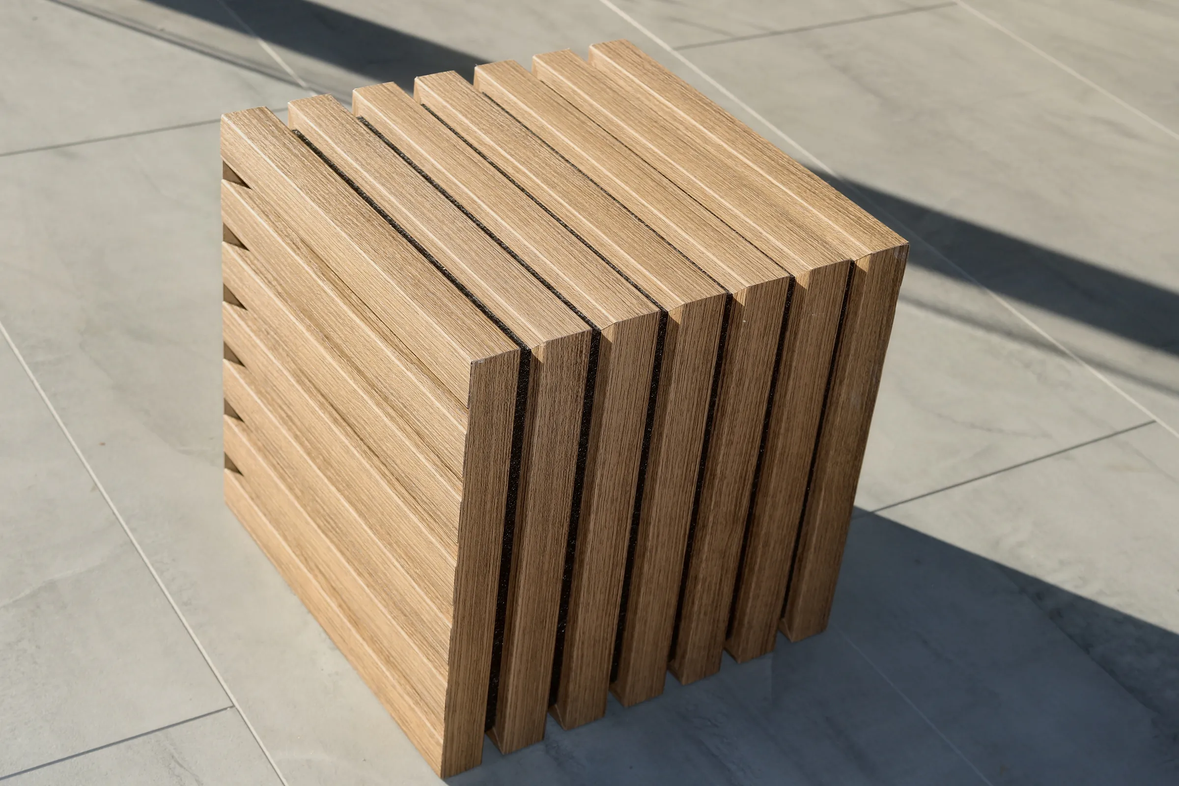 Oak profiles stood on the floor, showing their section and the depth of the grooves.